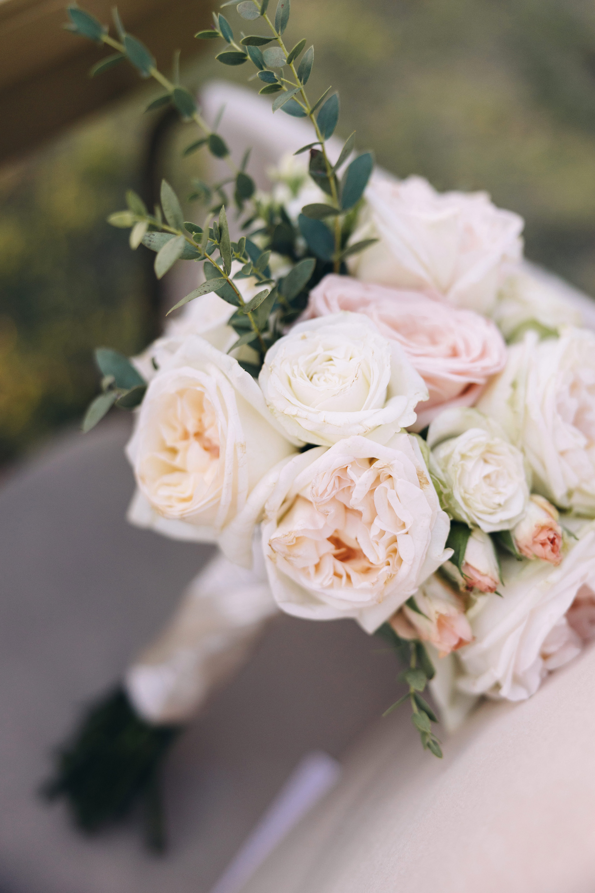 A bridal bouquet resting on a chair